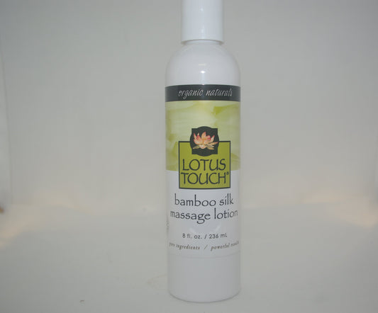 Bottle of Lotus Touch bamboo silk massage lotion on a white background