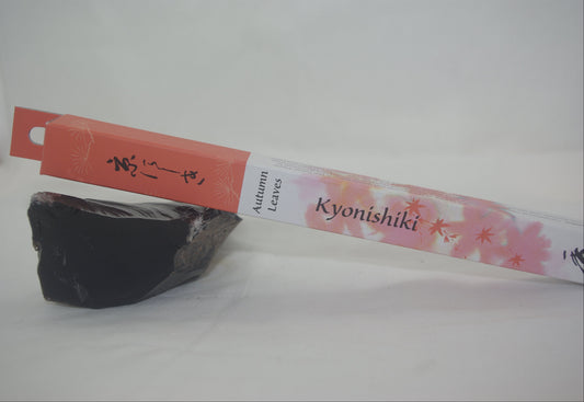 Kyonishiki tea packaging with a black stone on a white background