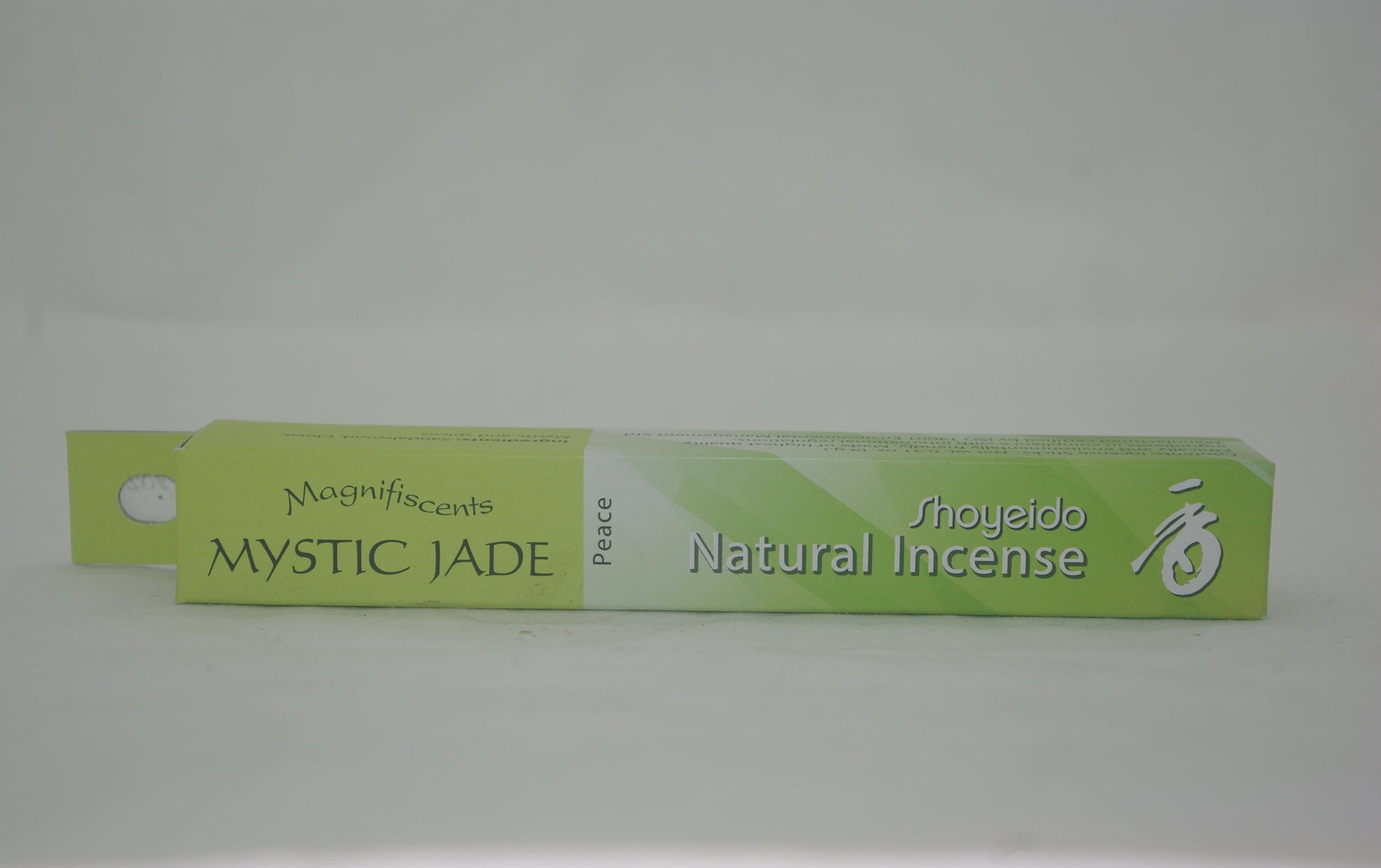 Green box of Shoyeido Mystic Jade natural incense on a white background