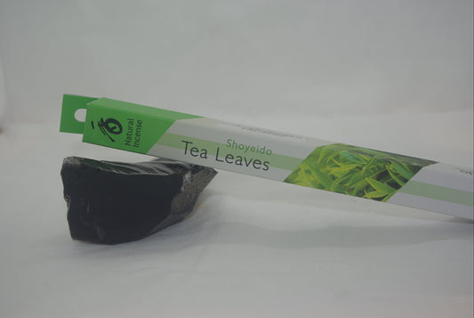 Tea leaves packaging with a black tea leaf on a white background